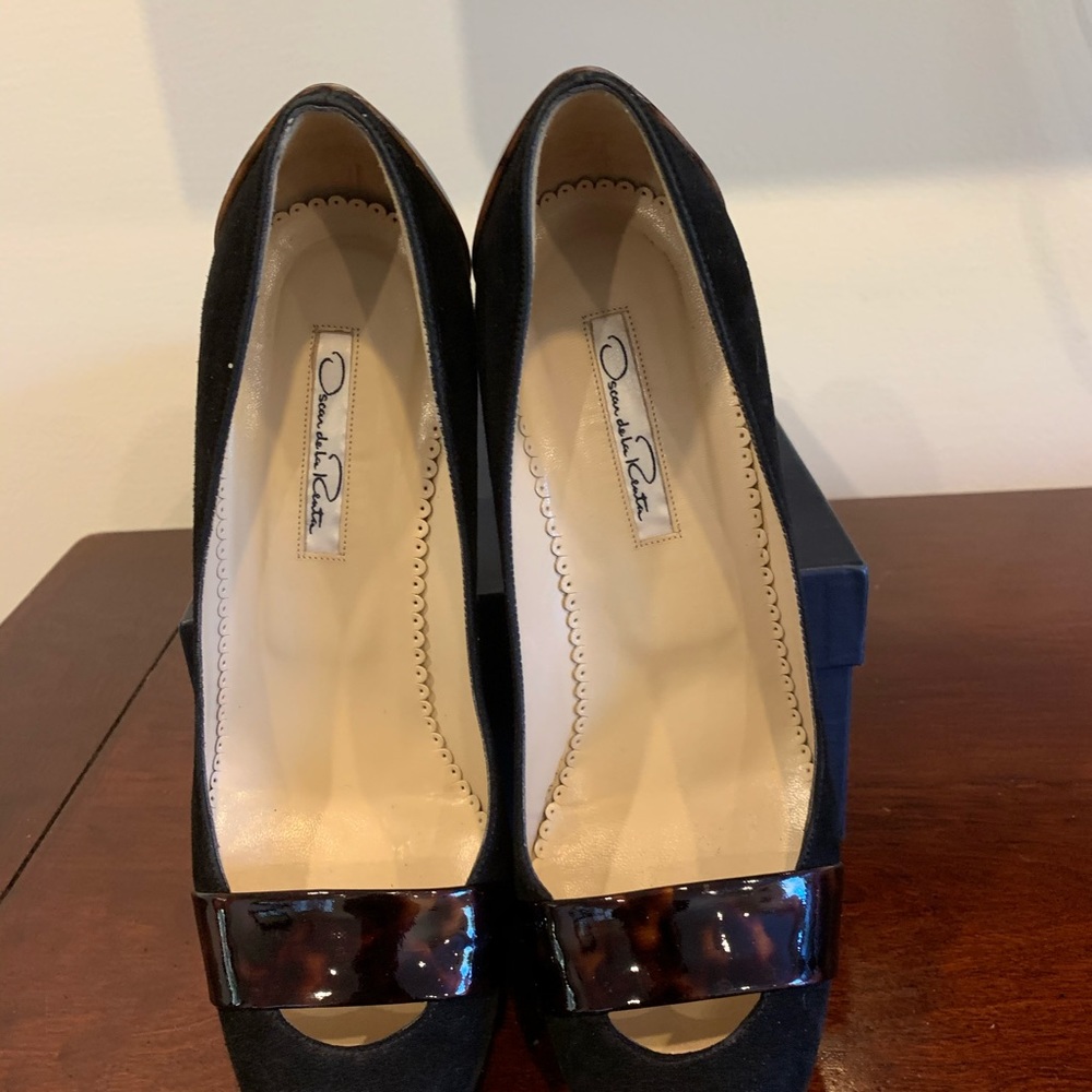 Matching set of used shoes and clutch
